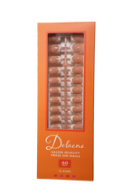 Packaged box of Delaene salon quality press-on nails with orange packaging and clear window. Box reads, "Delaene Salon Quality Press On Nails. 60 pieces. 15 sizes.” Box contains press-on nails with sheer nude base and beige colored tips in square shape, medium length, glossy finish.