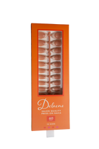 Packaged box of Delaene salon quality press-on nails with orange packaging and clear window. Box reads, "Delaene Salon Quality Press On Nails. 60 pieces. 15 sizes.” Box contains press-on nails with sheer nude base and beige colored tips in coffin shape, medium length, glossy finish.