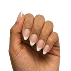 White French Tips press-on nails with sheer nude base and white French tips in almond or round almond shape, short length, matte finish, shown on hand