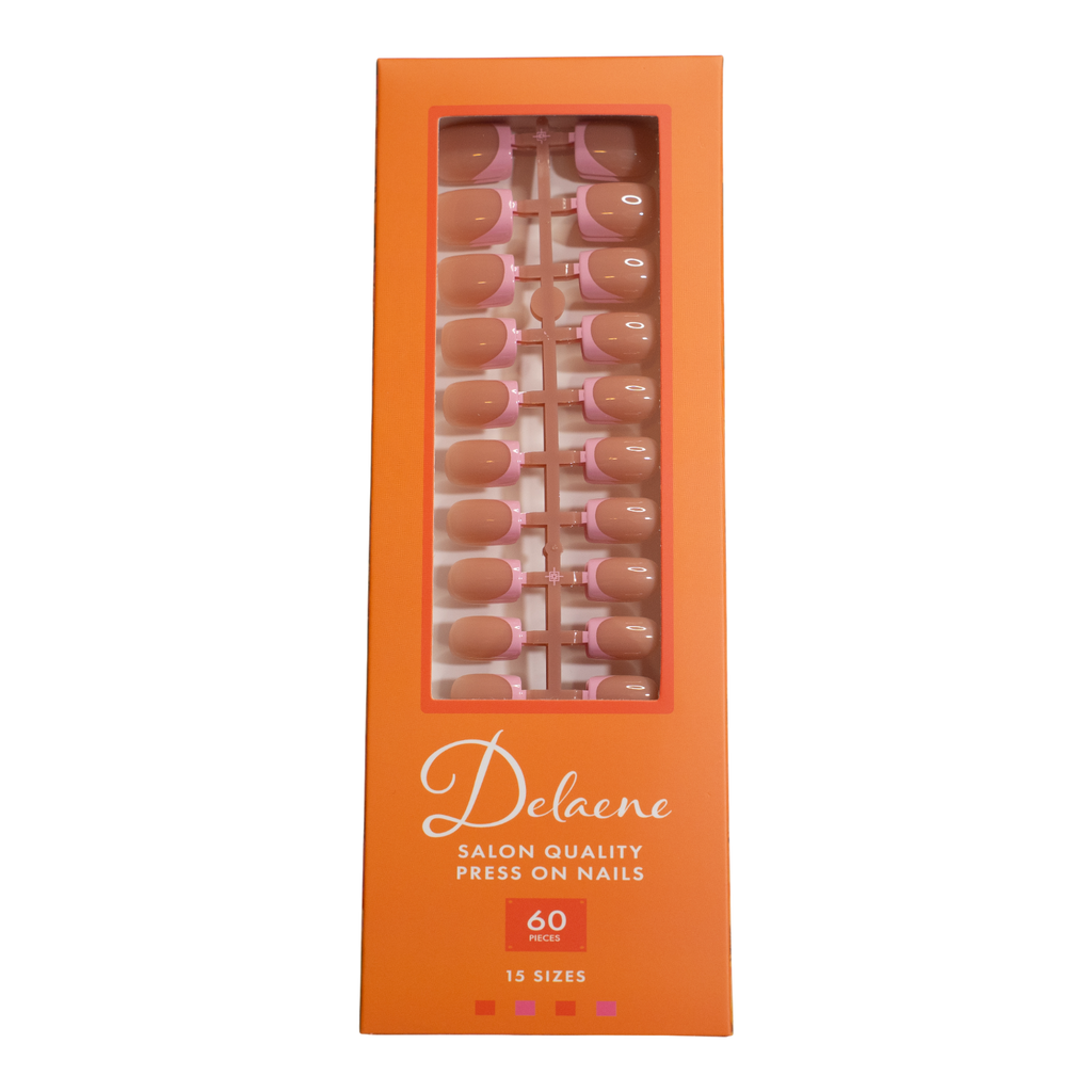 Orange box containing Baby Pink French Tips press-on nails with sheer nude base and soft pink French tips in square shape, short length, glossy finish, shown on hand 
